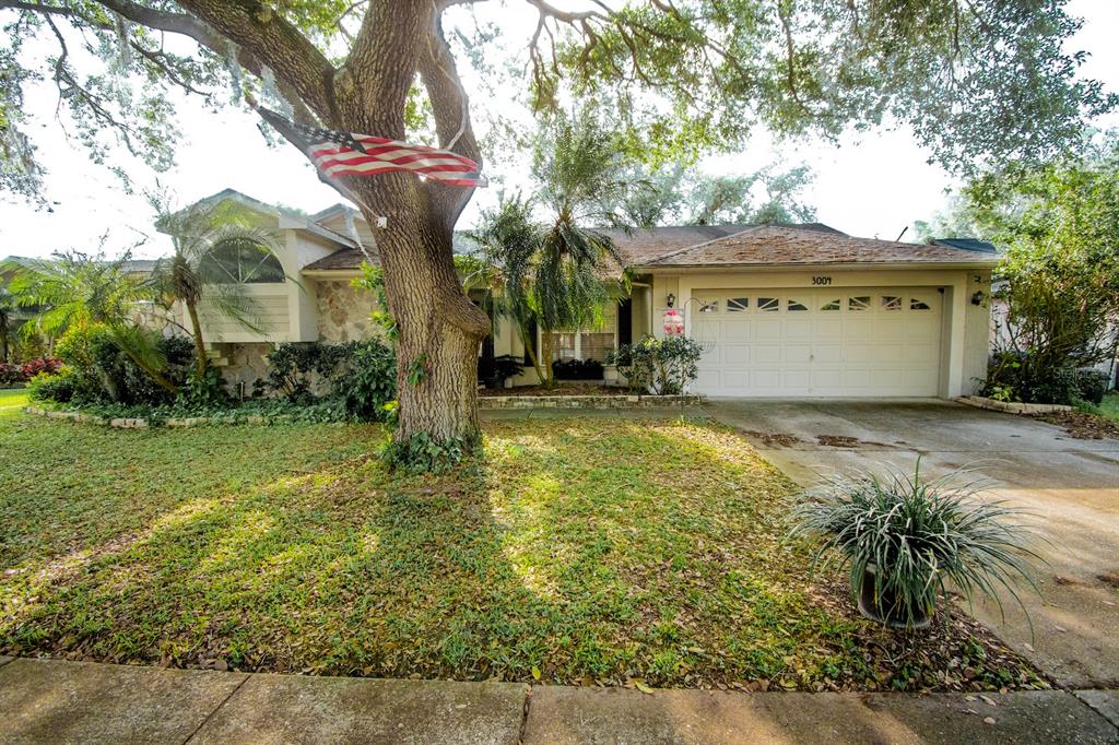 a view of a house with a yard