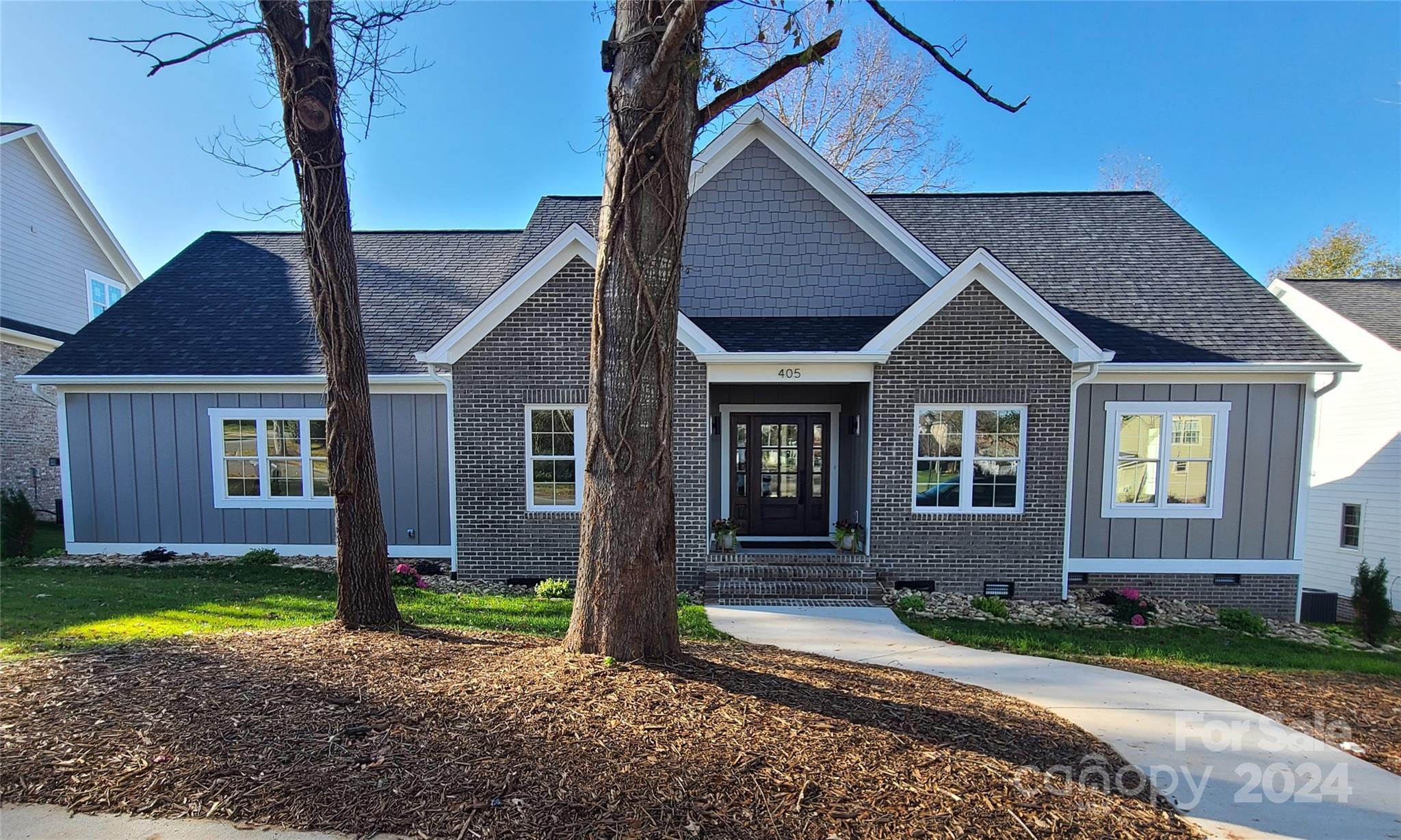 a front view of a house with a yard