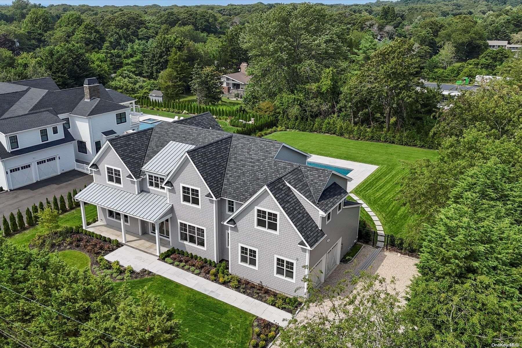 an aerial view of a house with a big yard