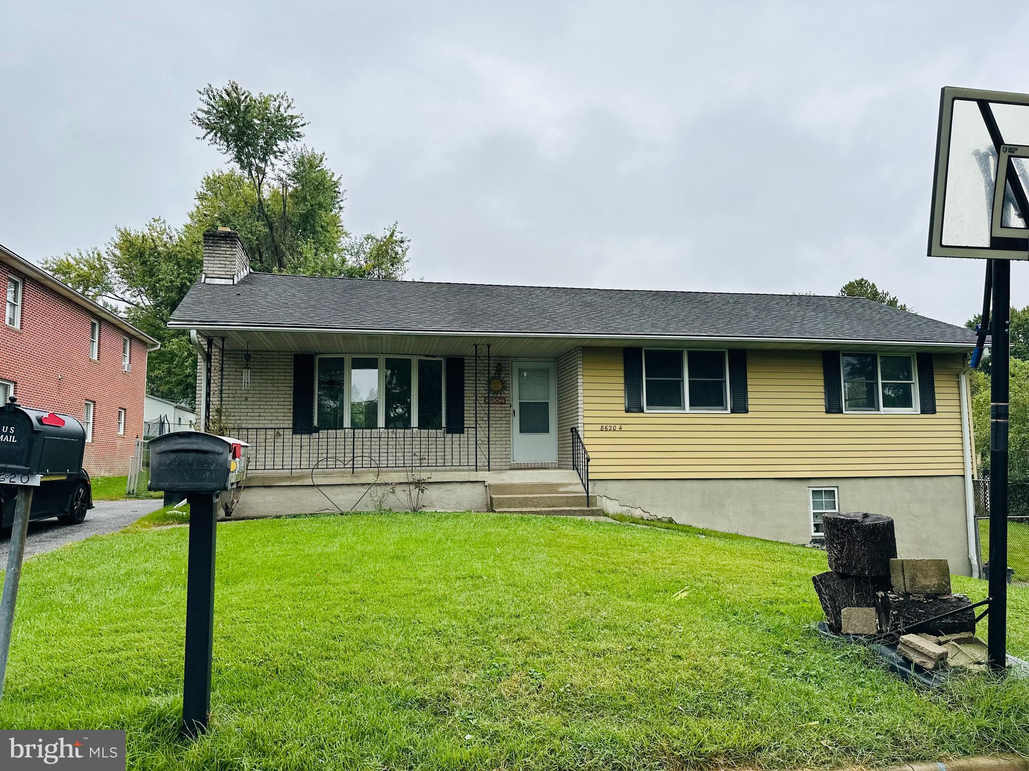 a front view of a house with a yard and porch