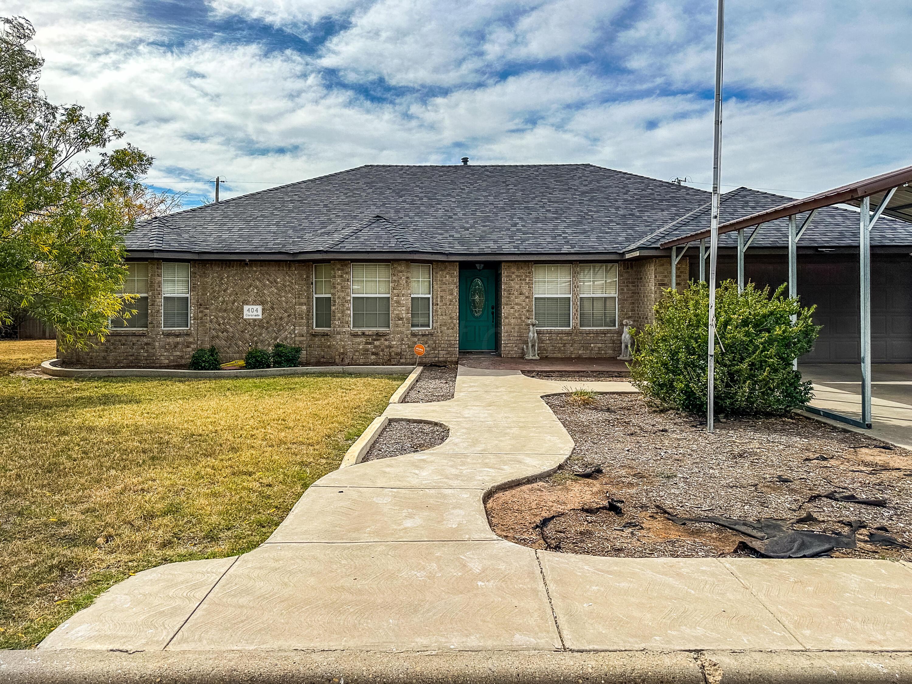 a front view of a house with yard