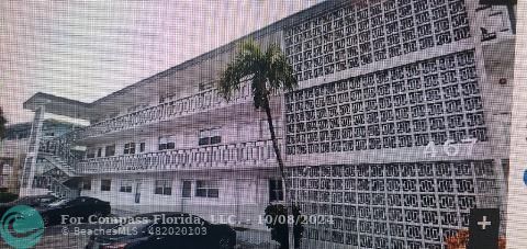 a front view of a building with glass windows