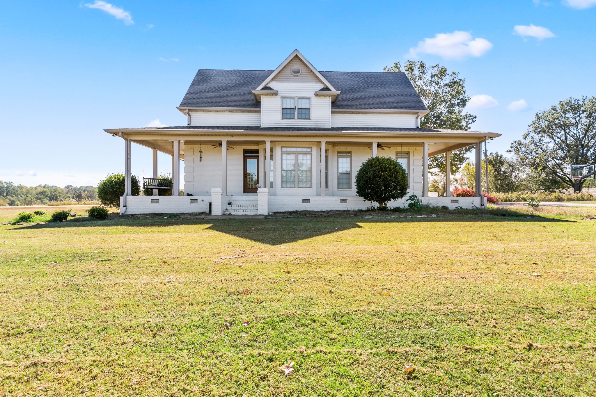 a front view of house with yard and outdoor seating