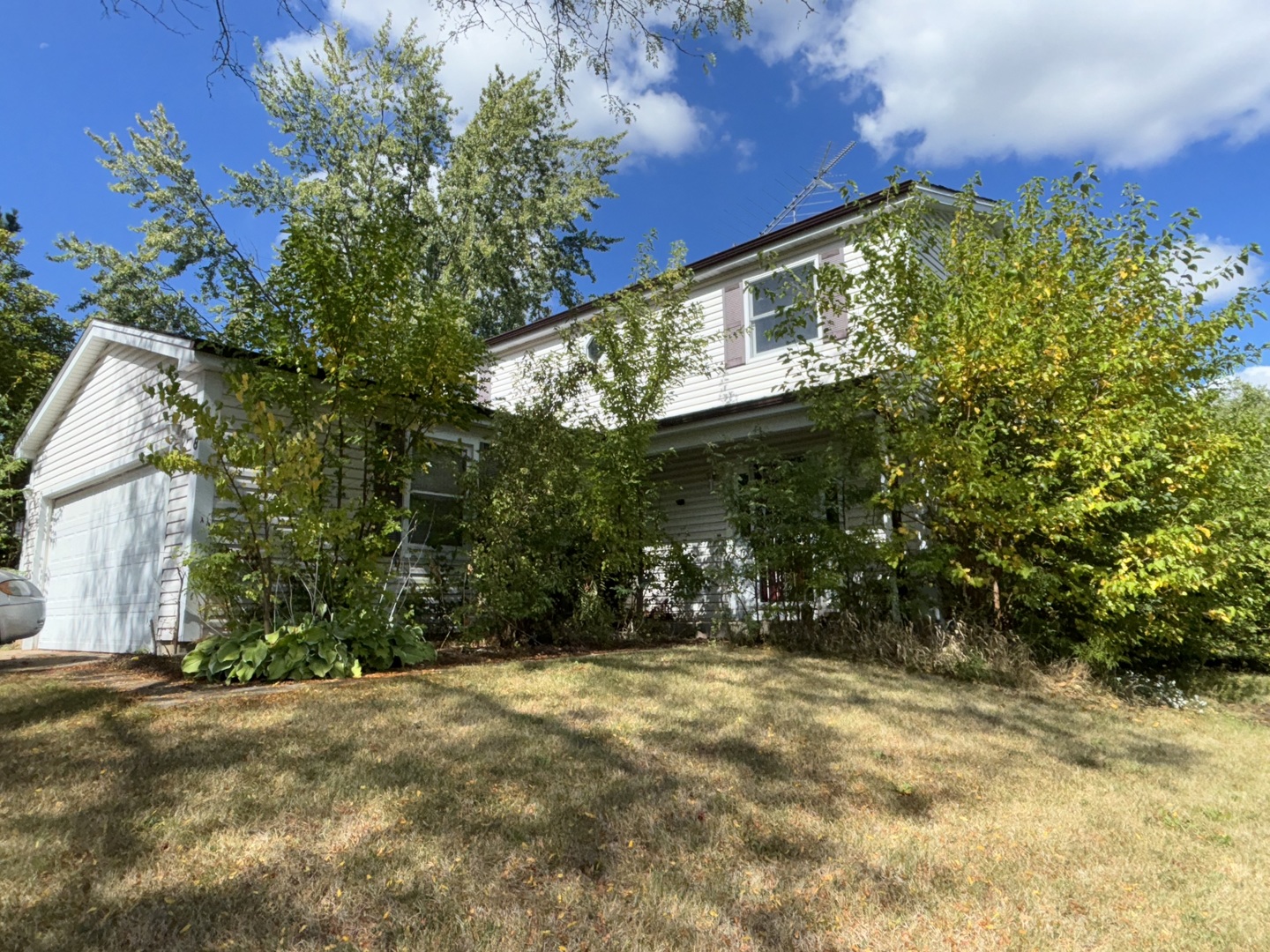 a view of a house with a tree