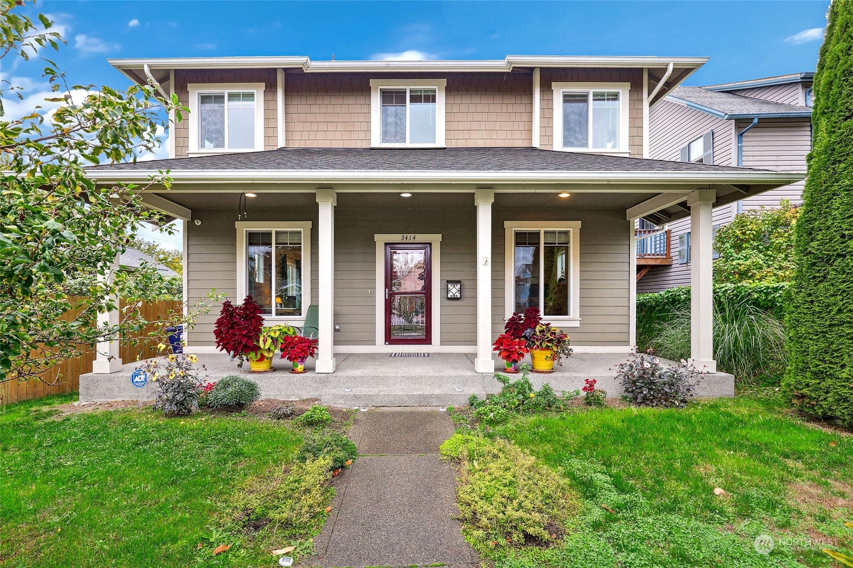 a front view of a house with an outdoor seating