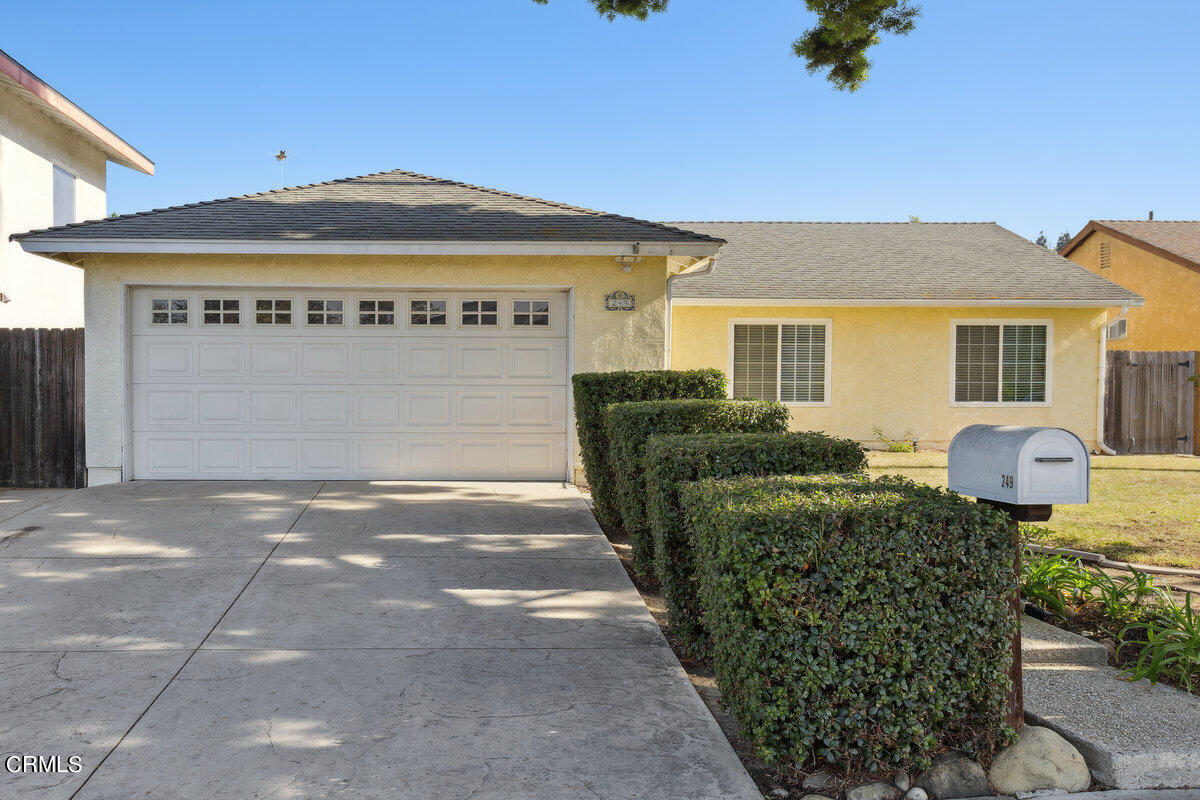 a front view of a house with yard