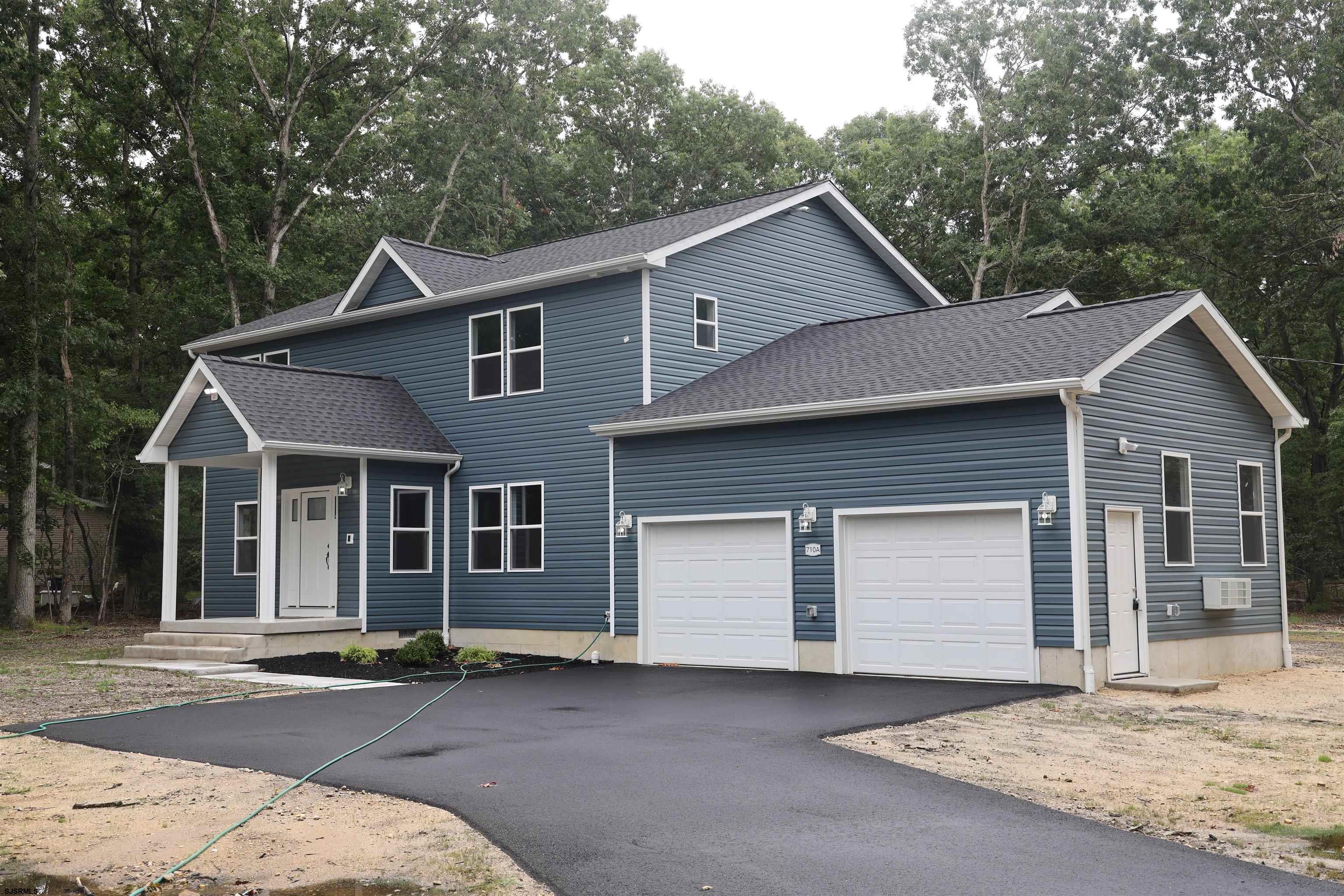 a front view of a house with a garage