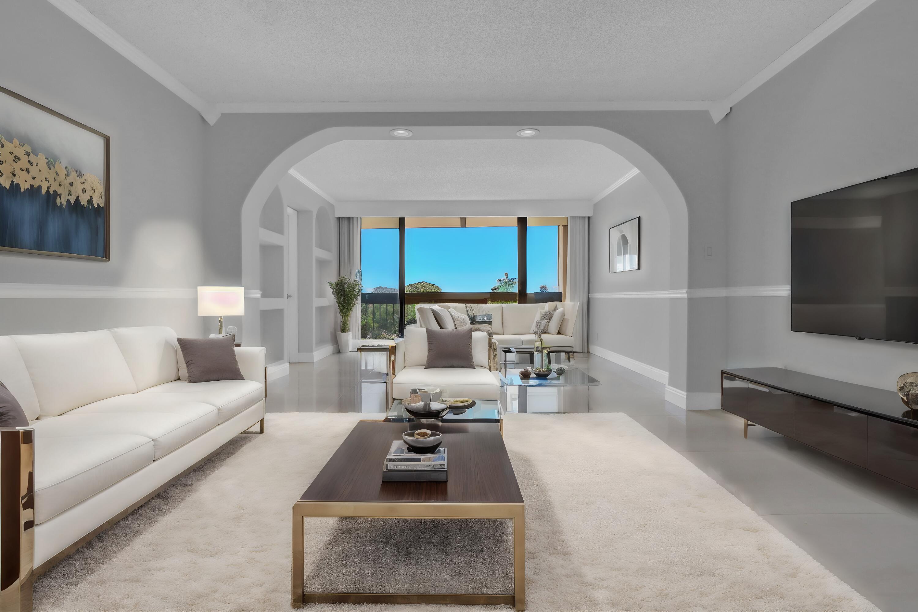 a living room with furniture a rug and a flat screen tv