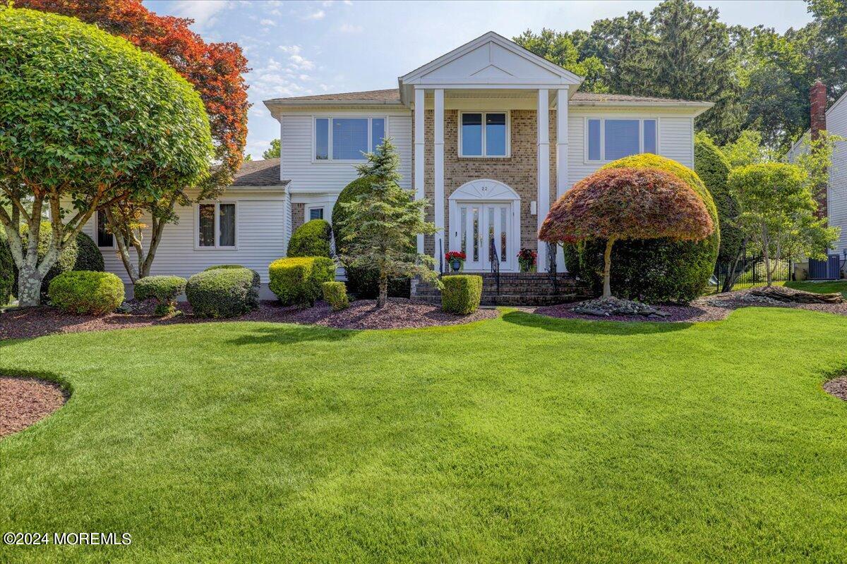 a front view of a house with garden