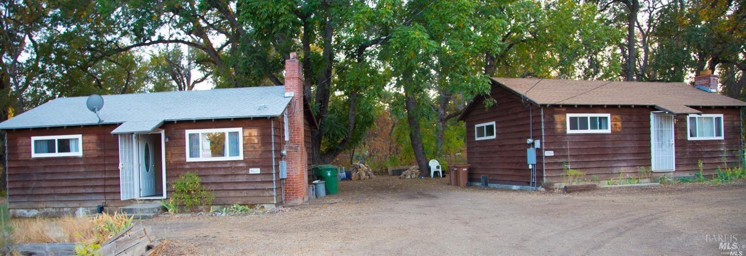 front view of a house with a tree