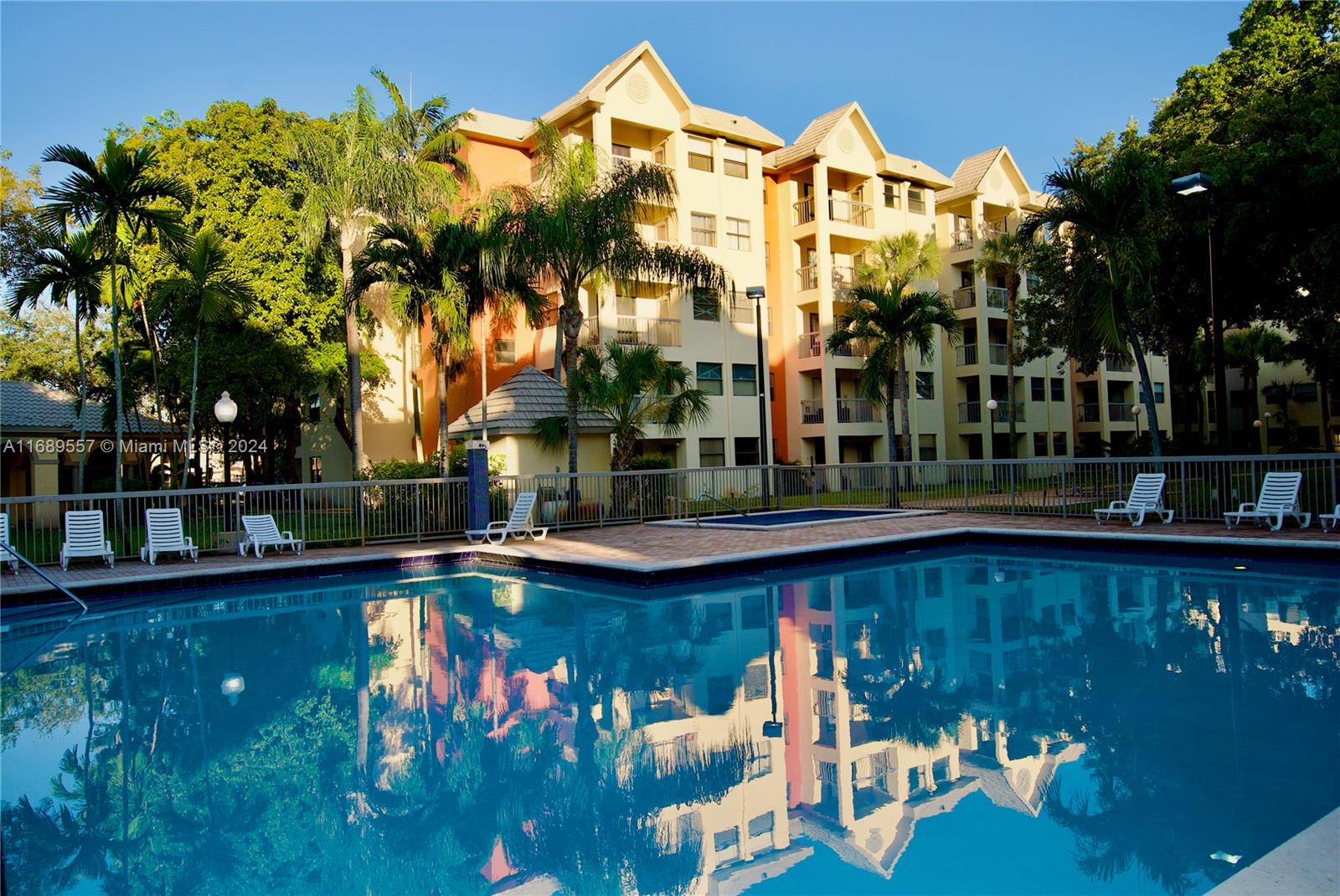 a view of swimming pool is middle in the garden