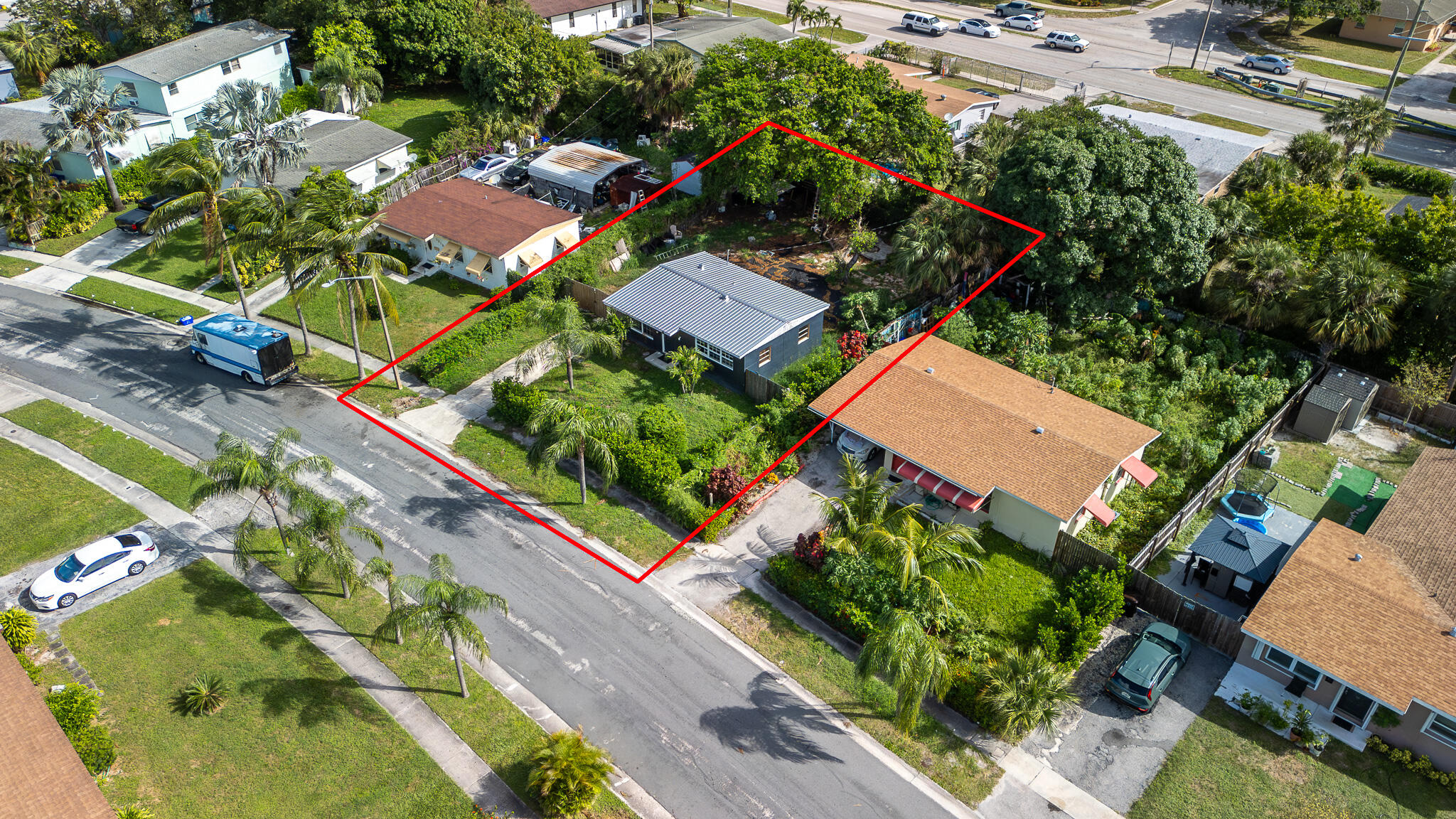 an aerial view of a residential houses with street