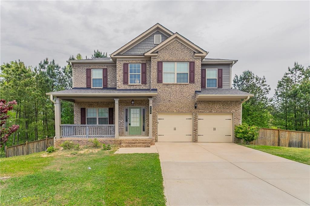 front view of a house with a yard