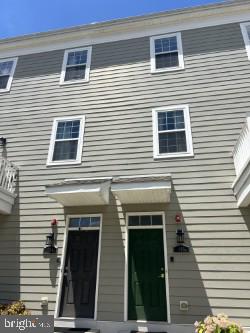 a view of a house with wooden deck