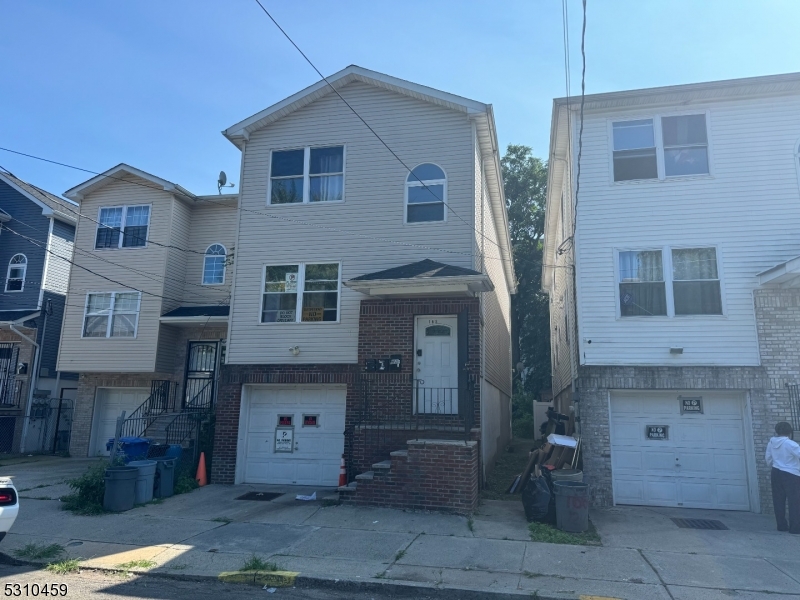 a front view of a house with parking