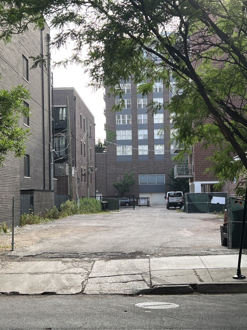 a view of a building with a yard