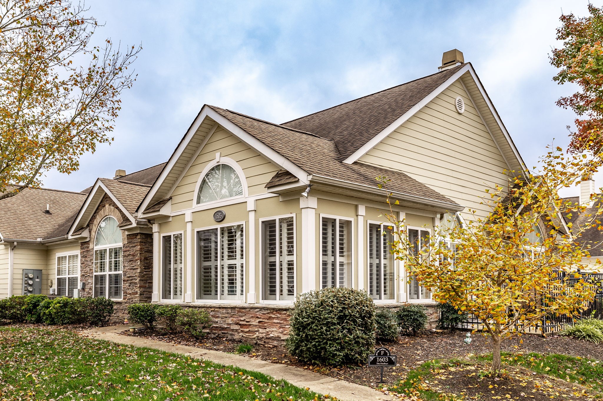 a front view of a house with a yard