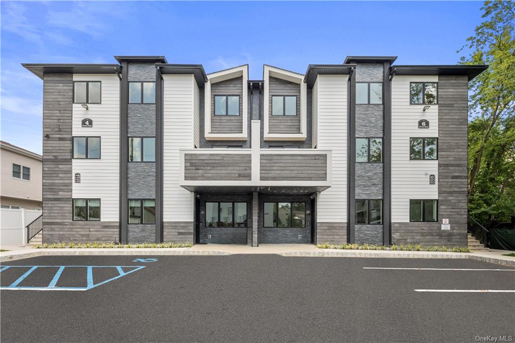 a front view of a building with street view