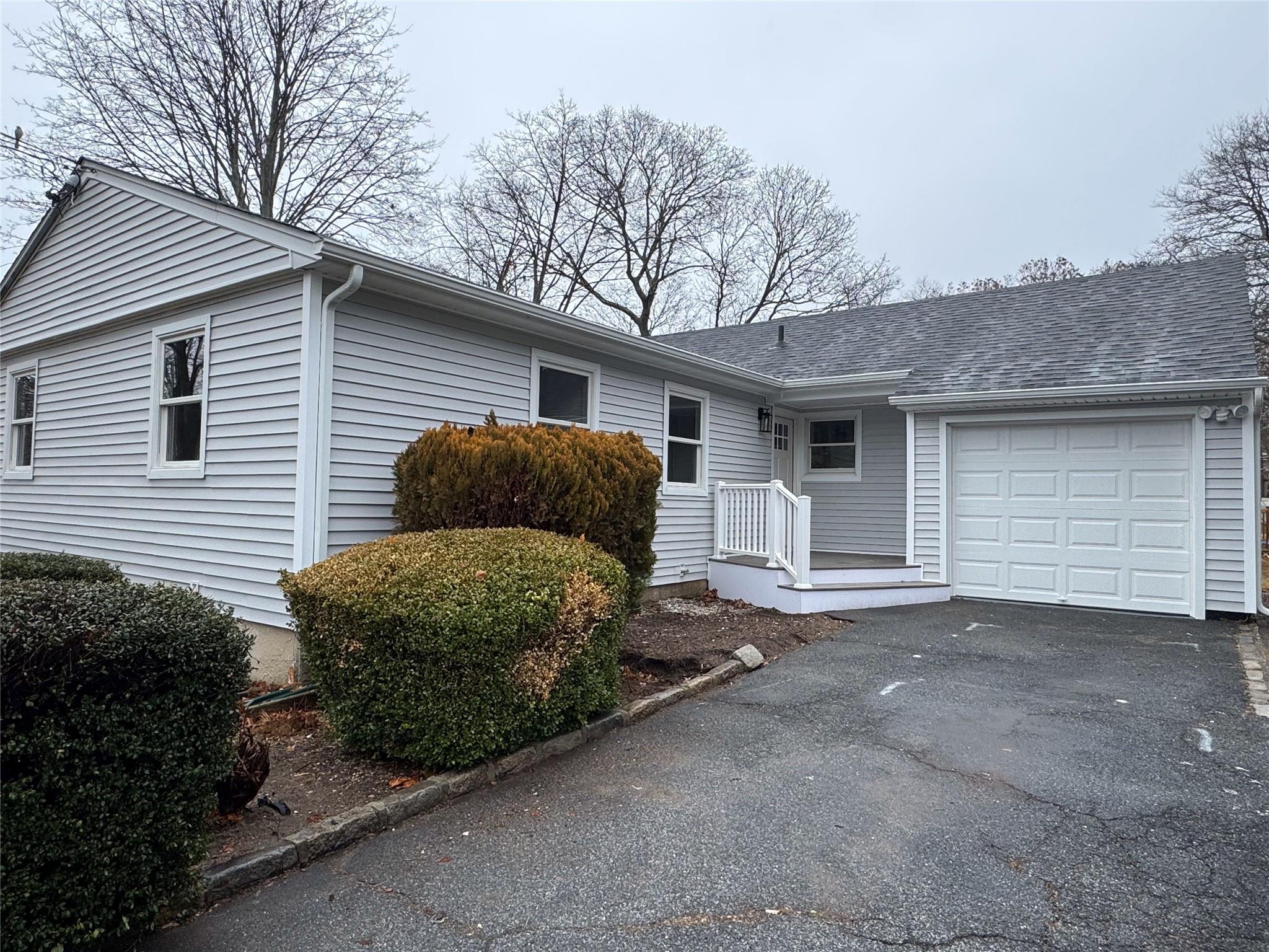 Single story home with a garage