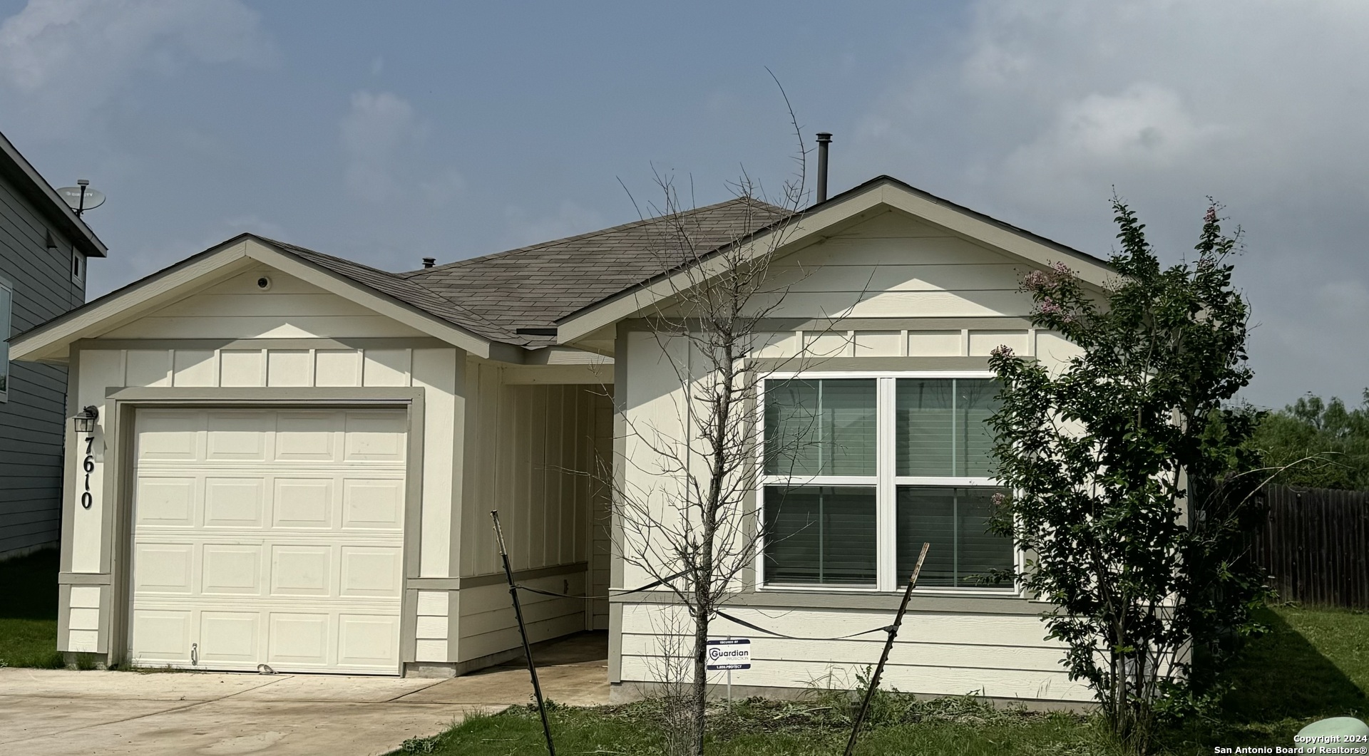 a front view of a house with garage