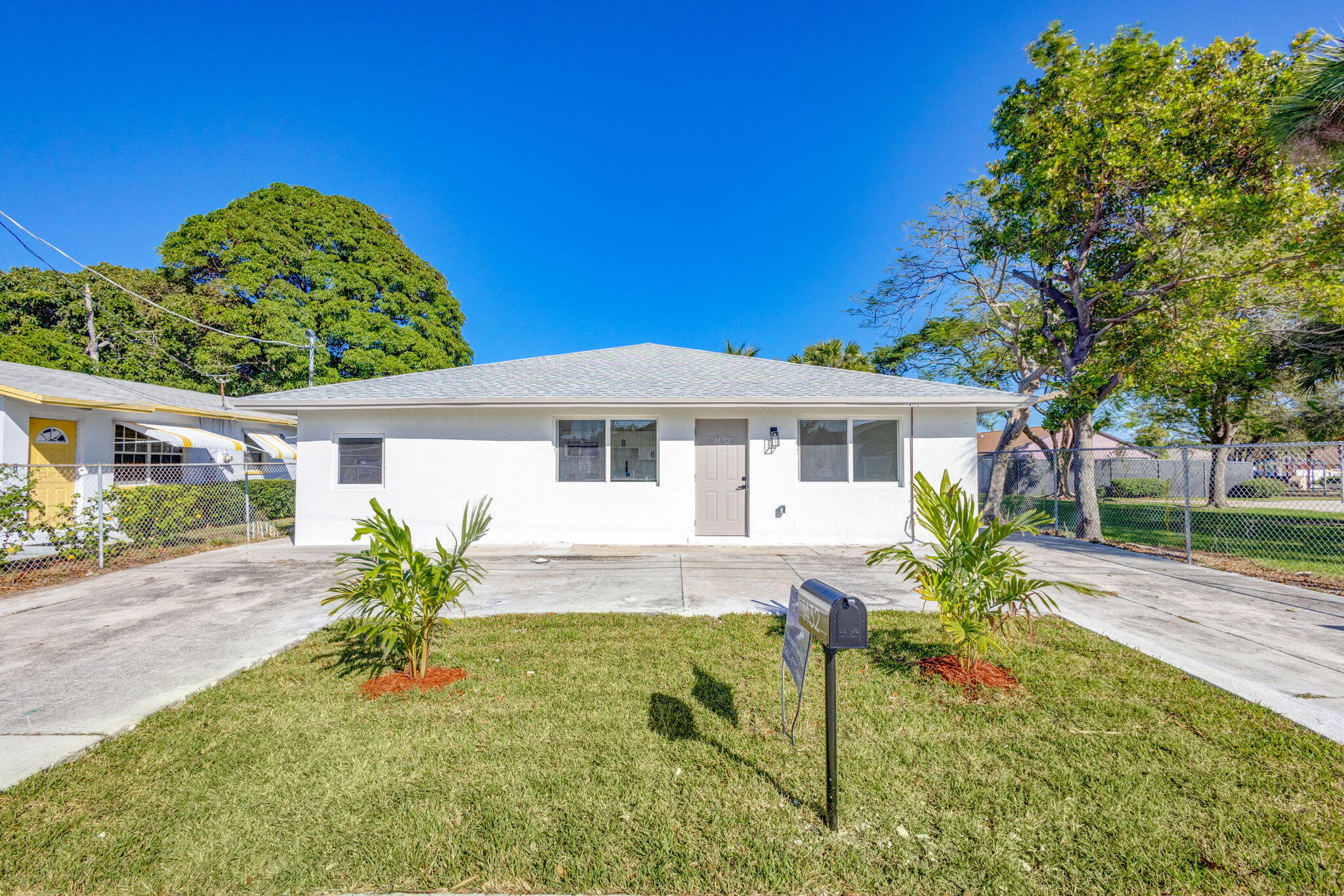 front view of a house with a yard