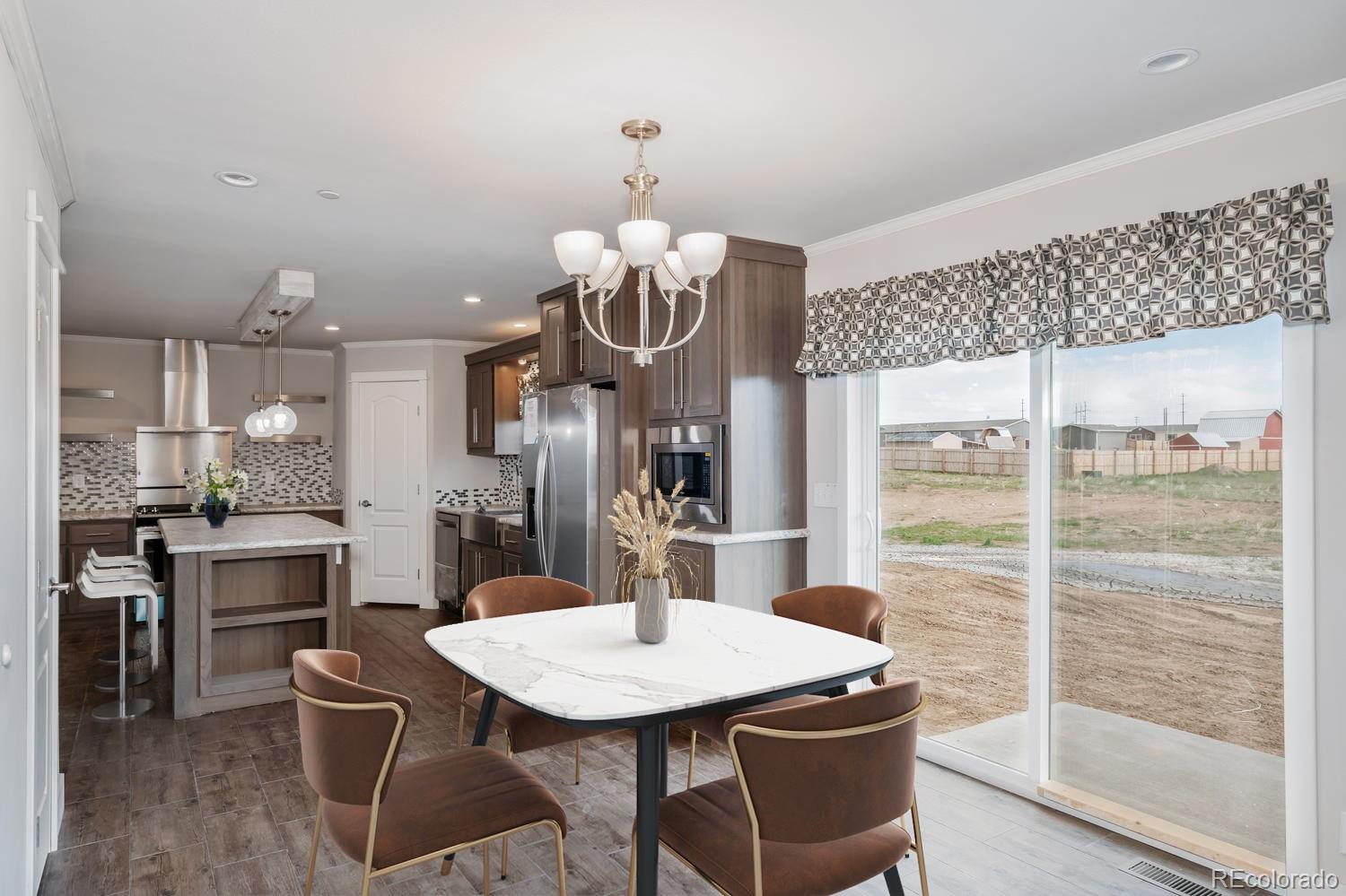 a kitchen with a table and chairs in it