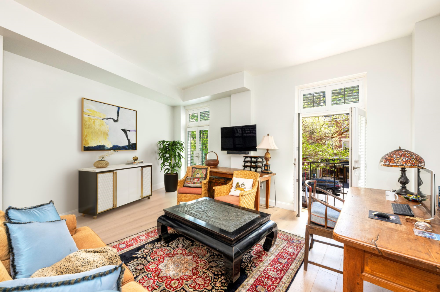 a living room with furniture and a flat screen tv