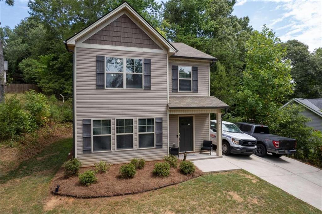 a front view of a house with a yard