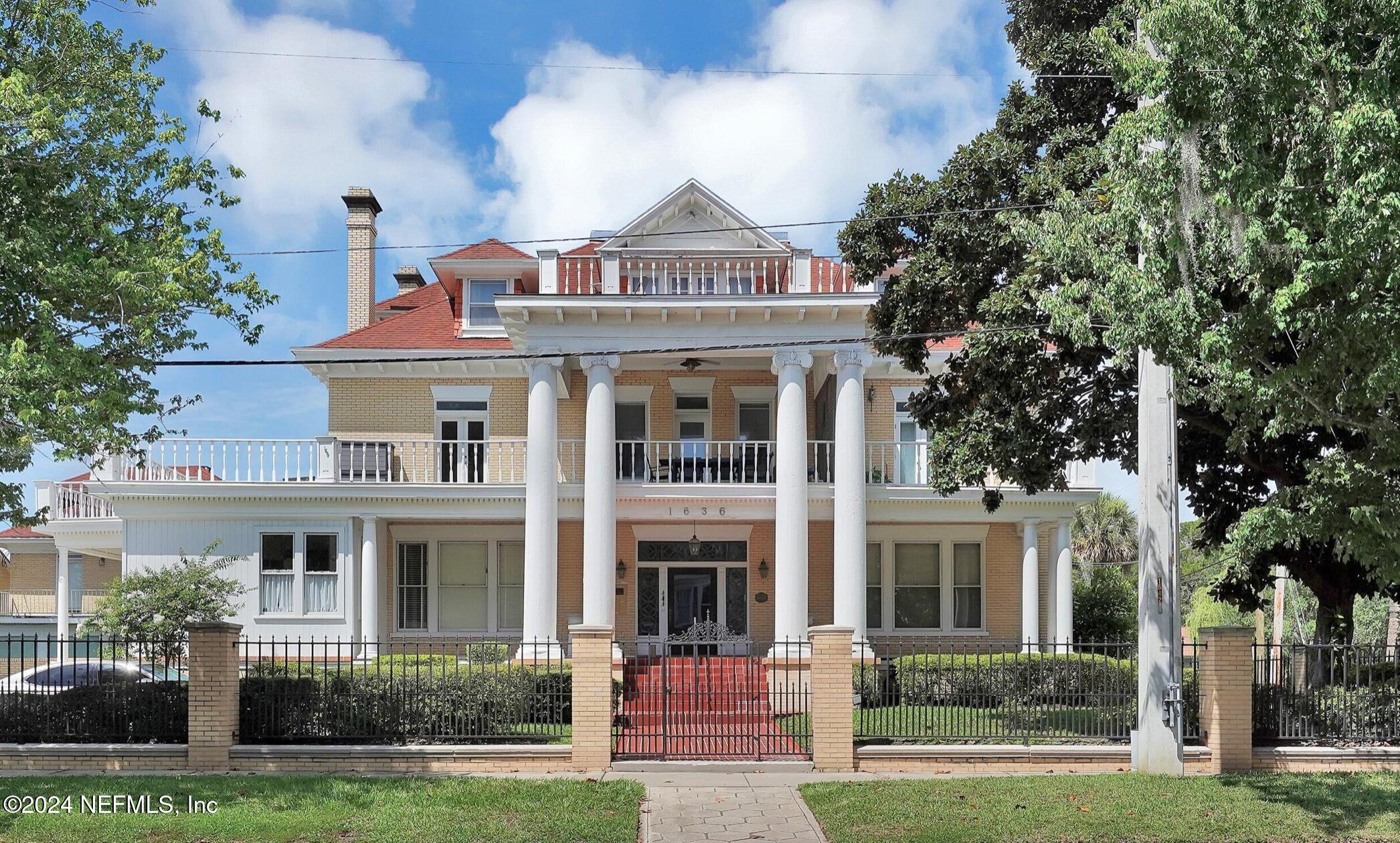 front view of a building with a yard