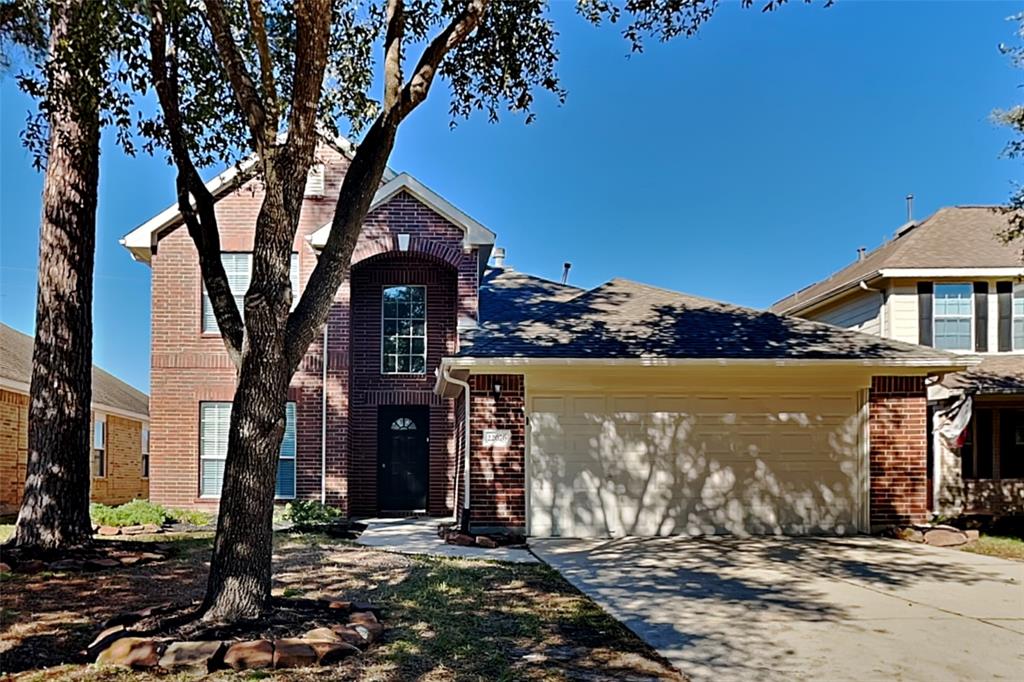 a view of a house with a tree