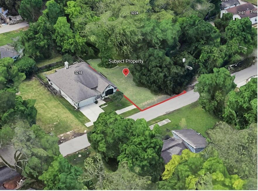 an aerial view of residential house with outdoor space