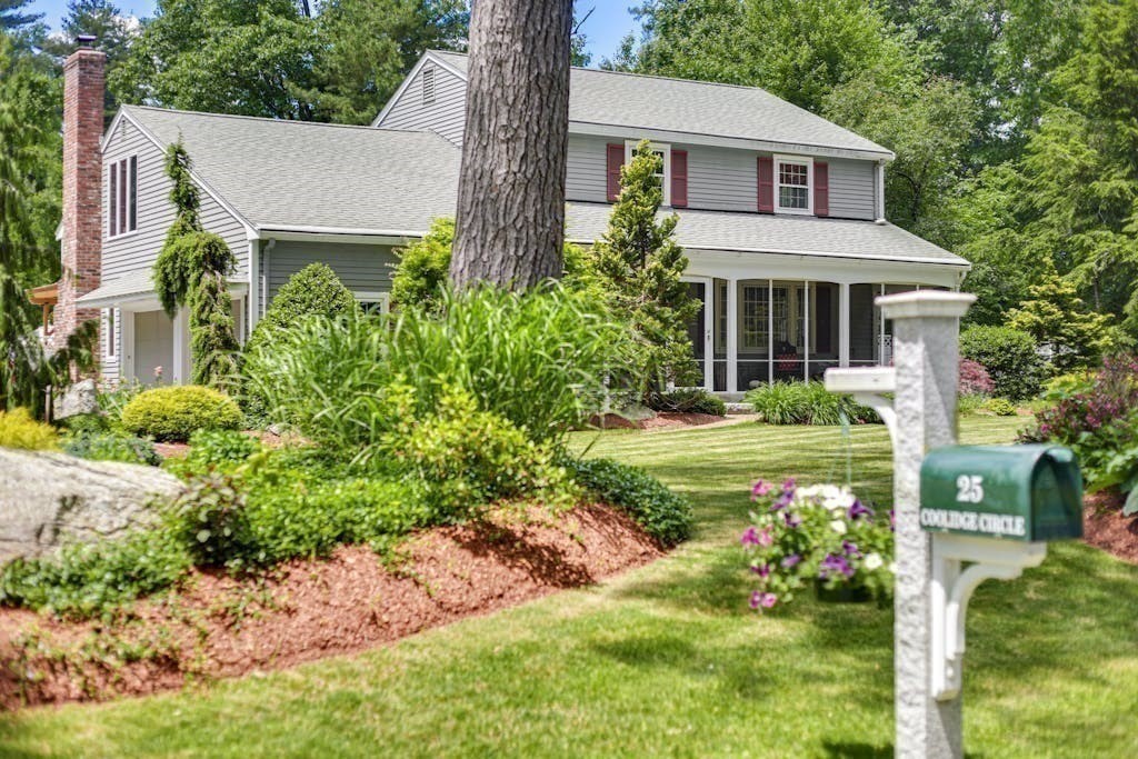 a front view of a house with a yard