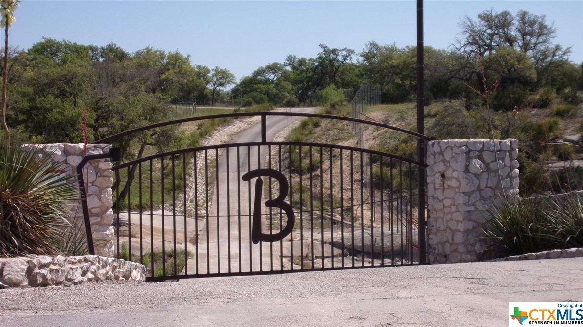 a view of a wrought iron fences in front of house