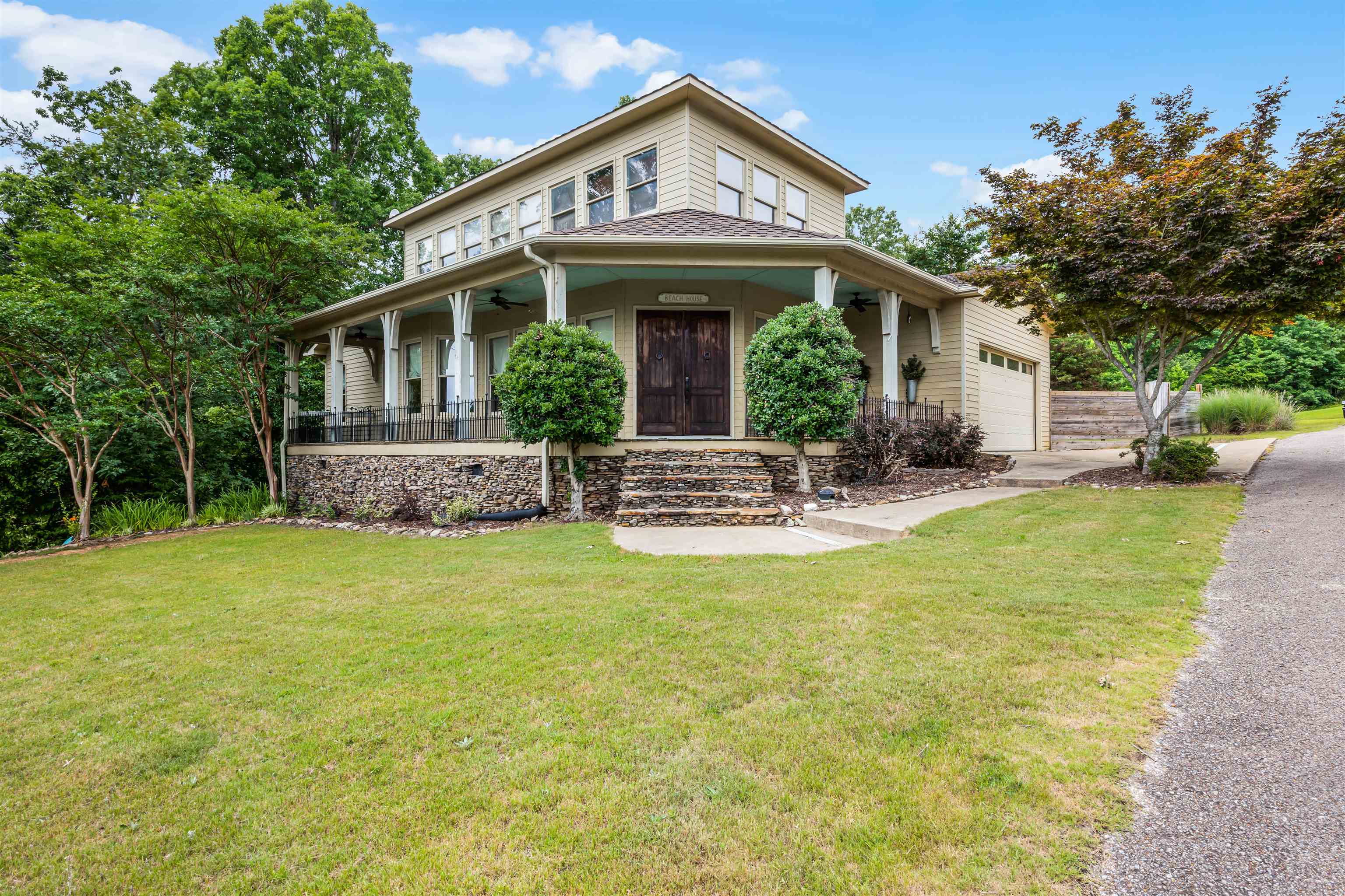 a front view of house with yard and outdoor seating