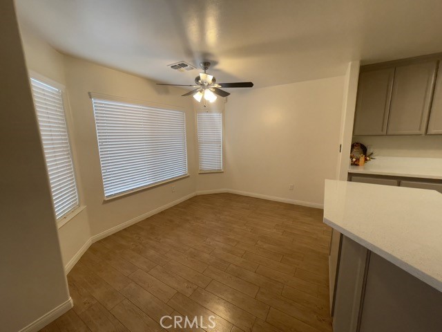 a view of a kitchen with a sink and cabinet