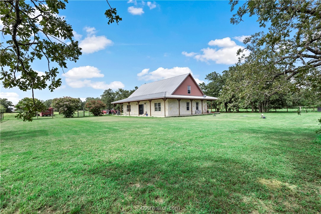 a view of a house with a big yard