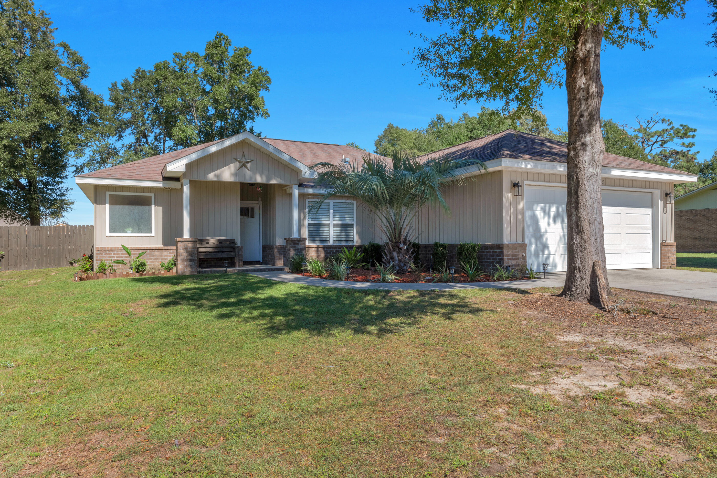 a front view of a house with a yard and porch