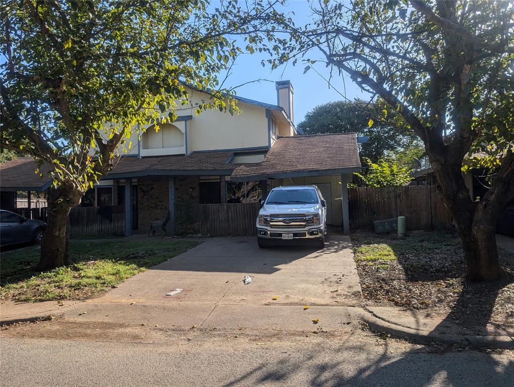 a front view of a house with yard and seating area