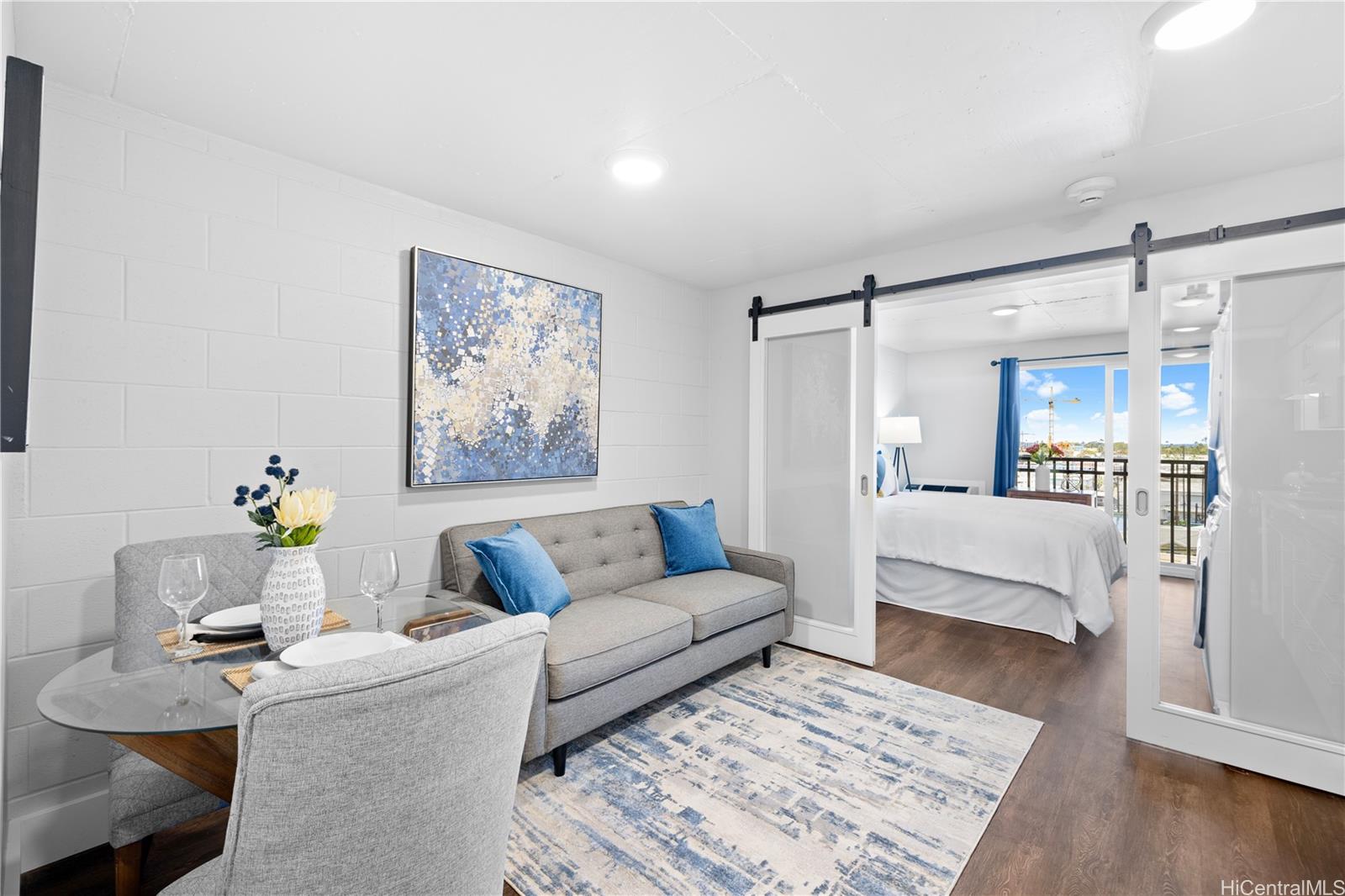 a living room with furniture and a rug