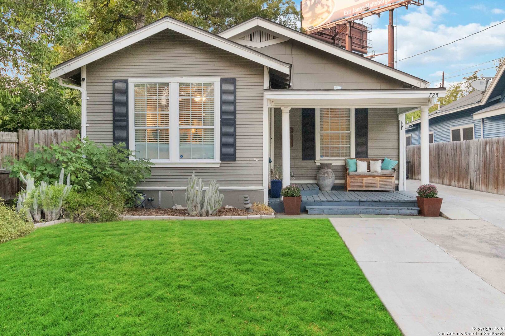 a front view of a house with a yard and porch