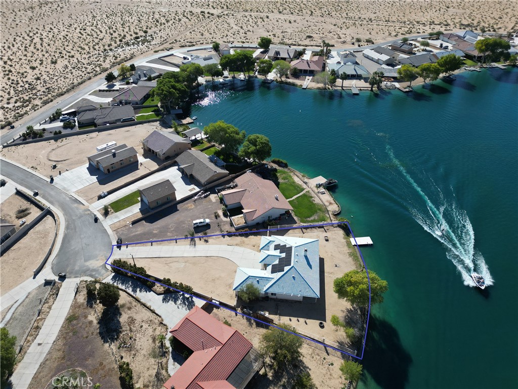 an aerial view of a house with a lake view