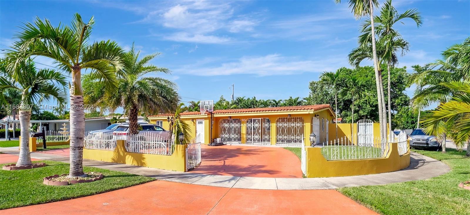 a view of a house with swimming pool and a small yard