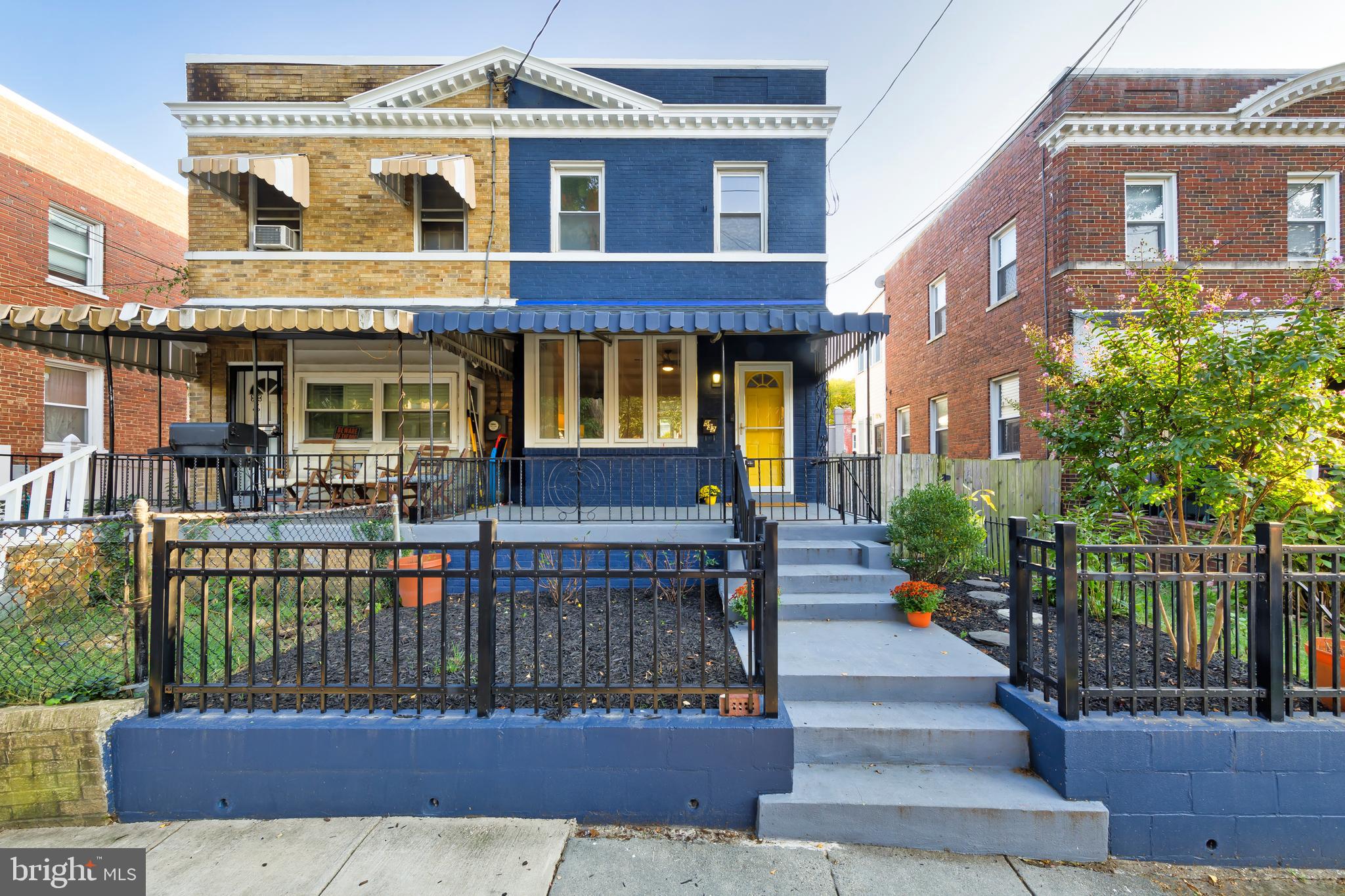 a front view of a house with a garden