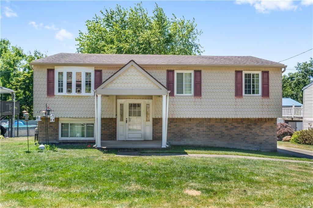 front view of a house with a yard