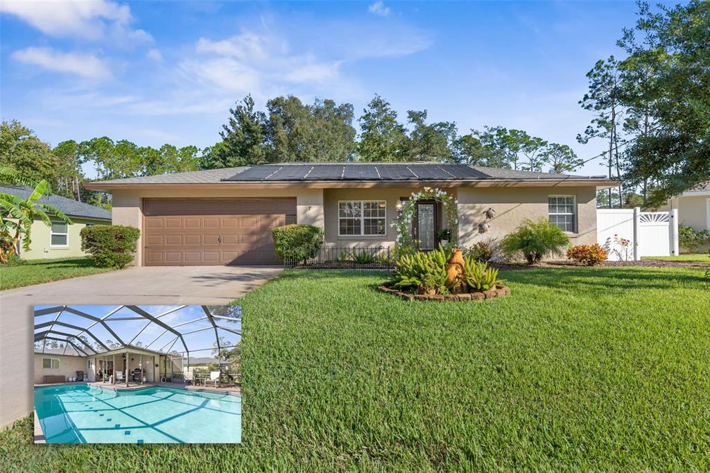 a view of house with backyard and outdoor seating