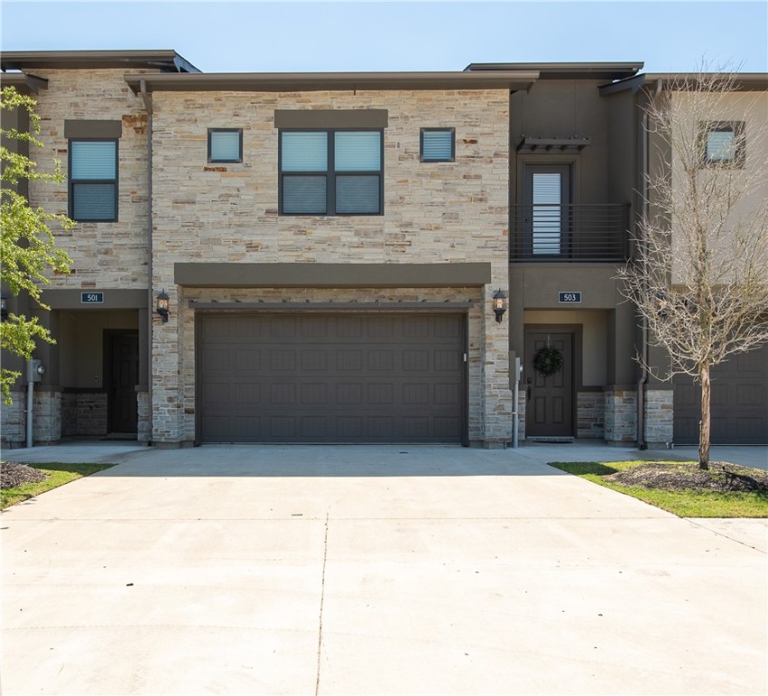 View of property with a garage