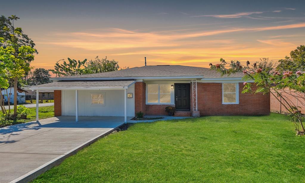 front view of a house with a yard