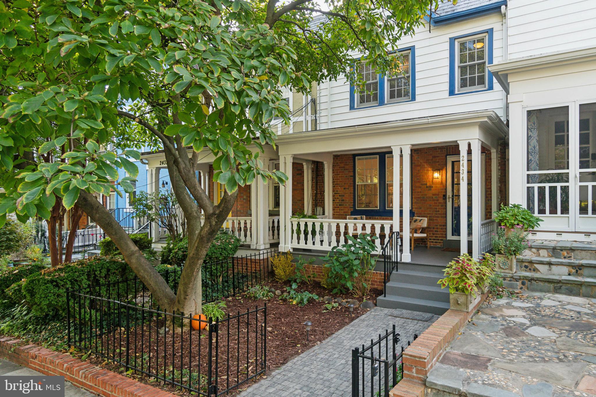 front view of a house with a chairs