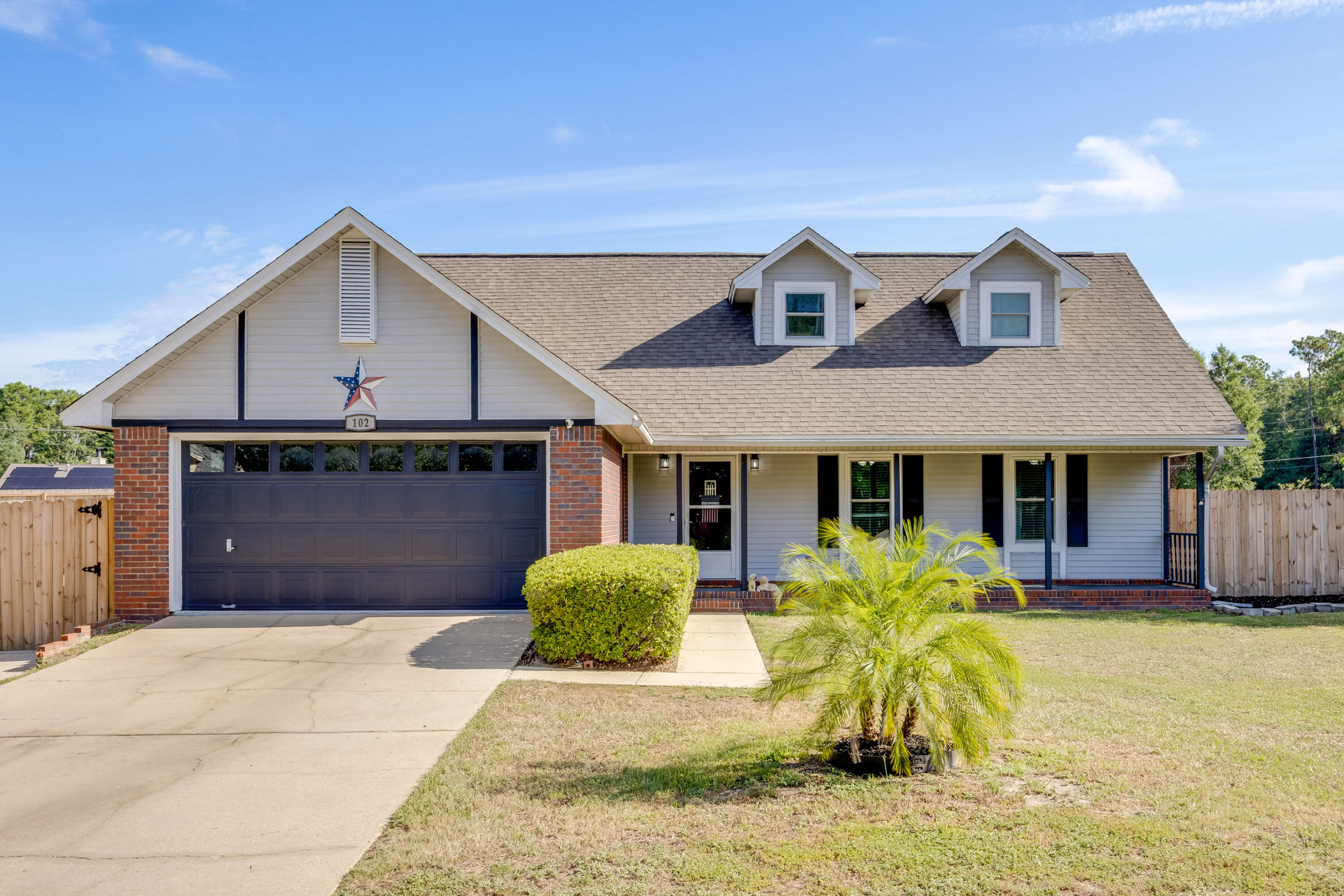 a front view of house with yard