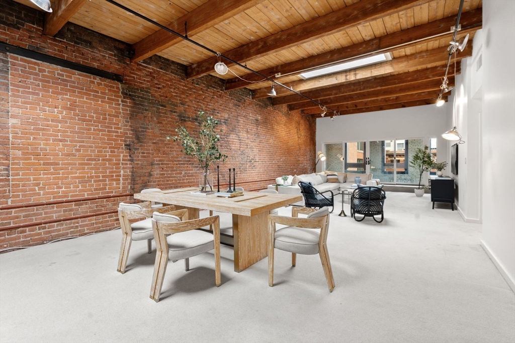 a view of a dinning table and chairs in the patio